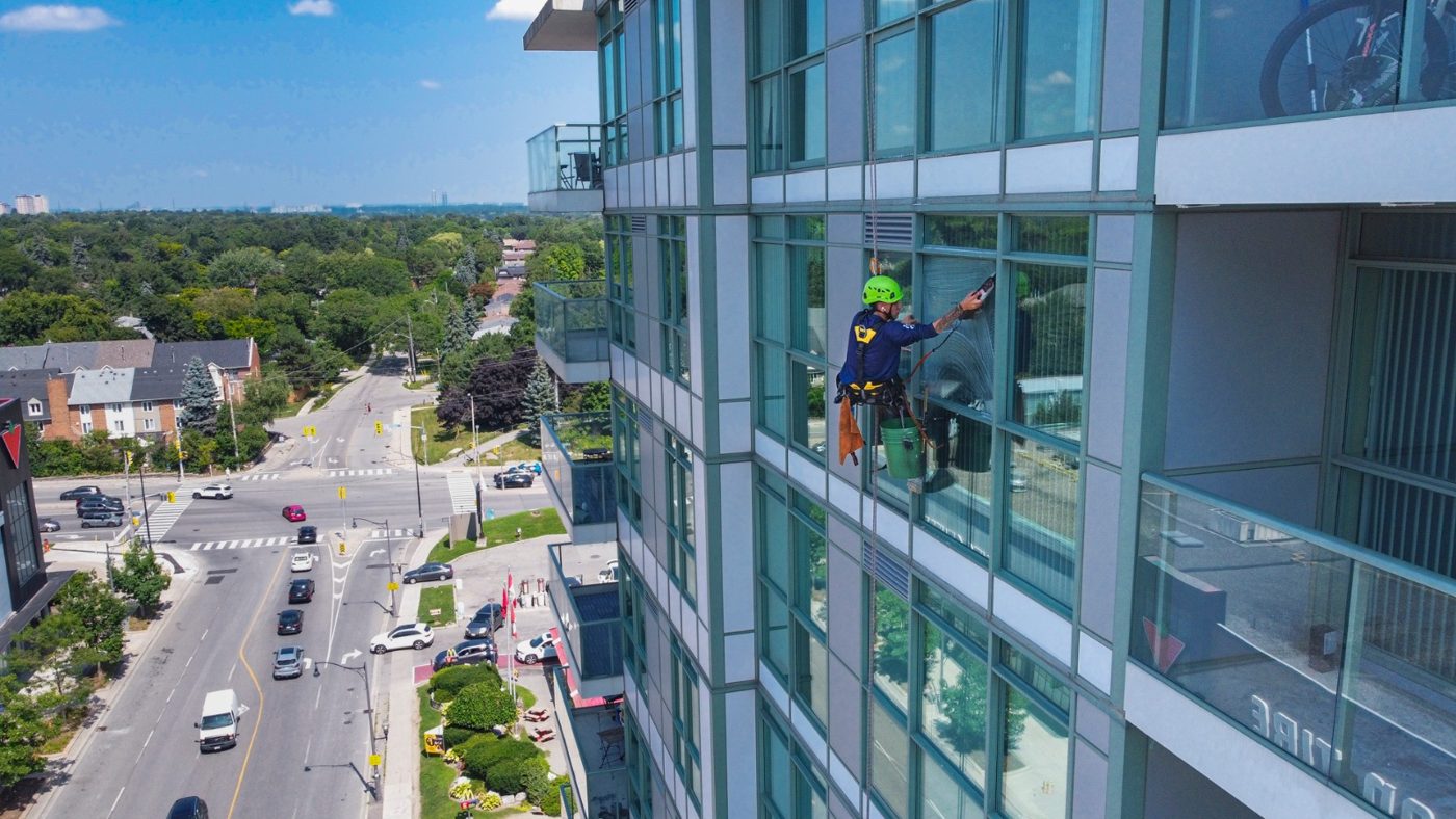 Rope access curtain wall maintenance above the city