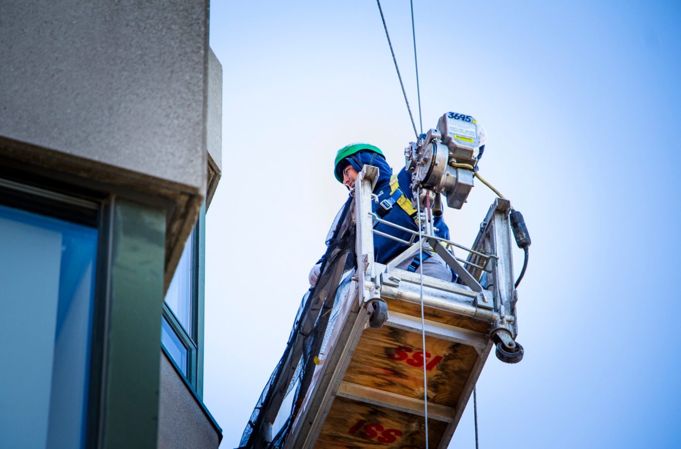 Balcony soffit repair from a swing stage